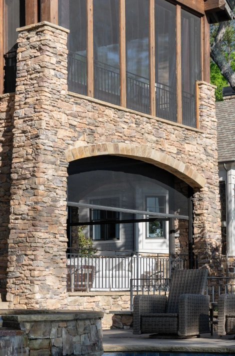 balcony with fixed screens over porch with retractable screens