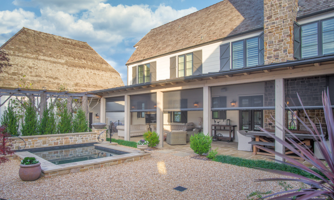 Porch with retractable screens overlooking pool