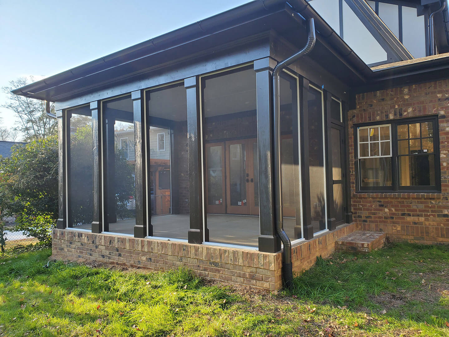 Fixed screen enclosure added to a residential porch