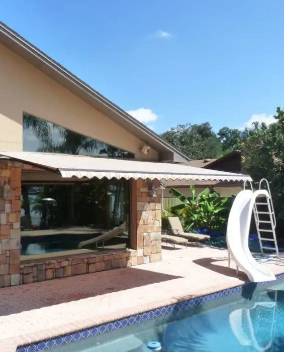 motorized retractable awning backyard with pool