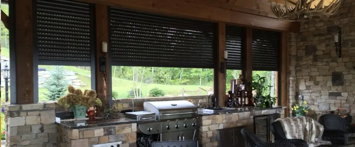 outdoor kitchen with retractable shutters