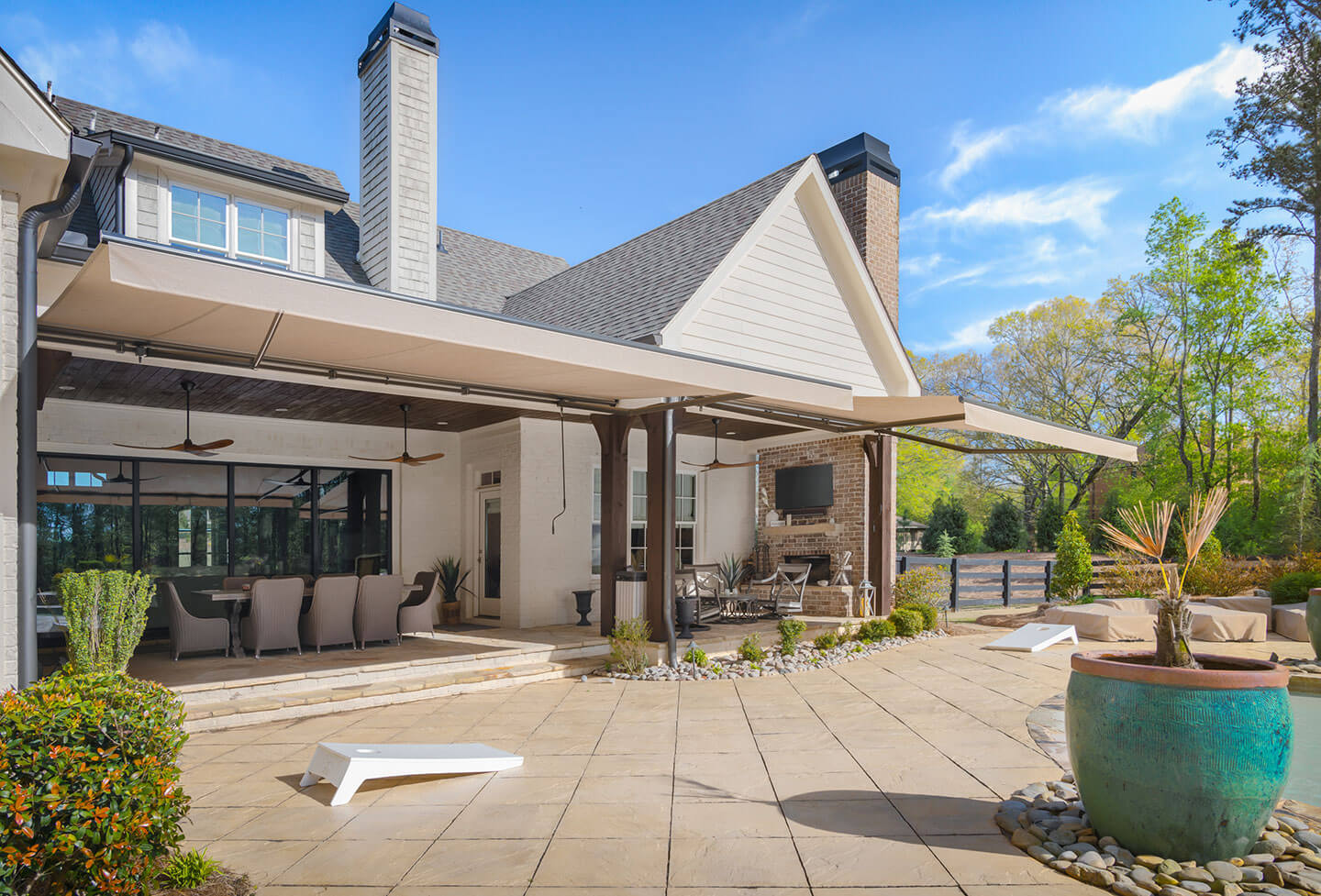 Retractable patio awning extended over a residential outdoor seating area