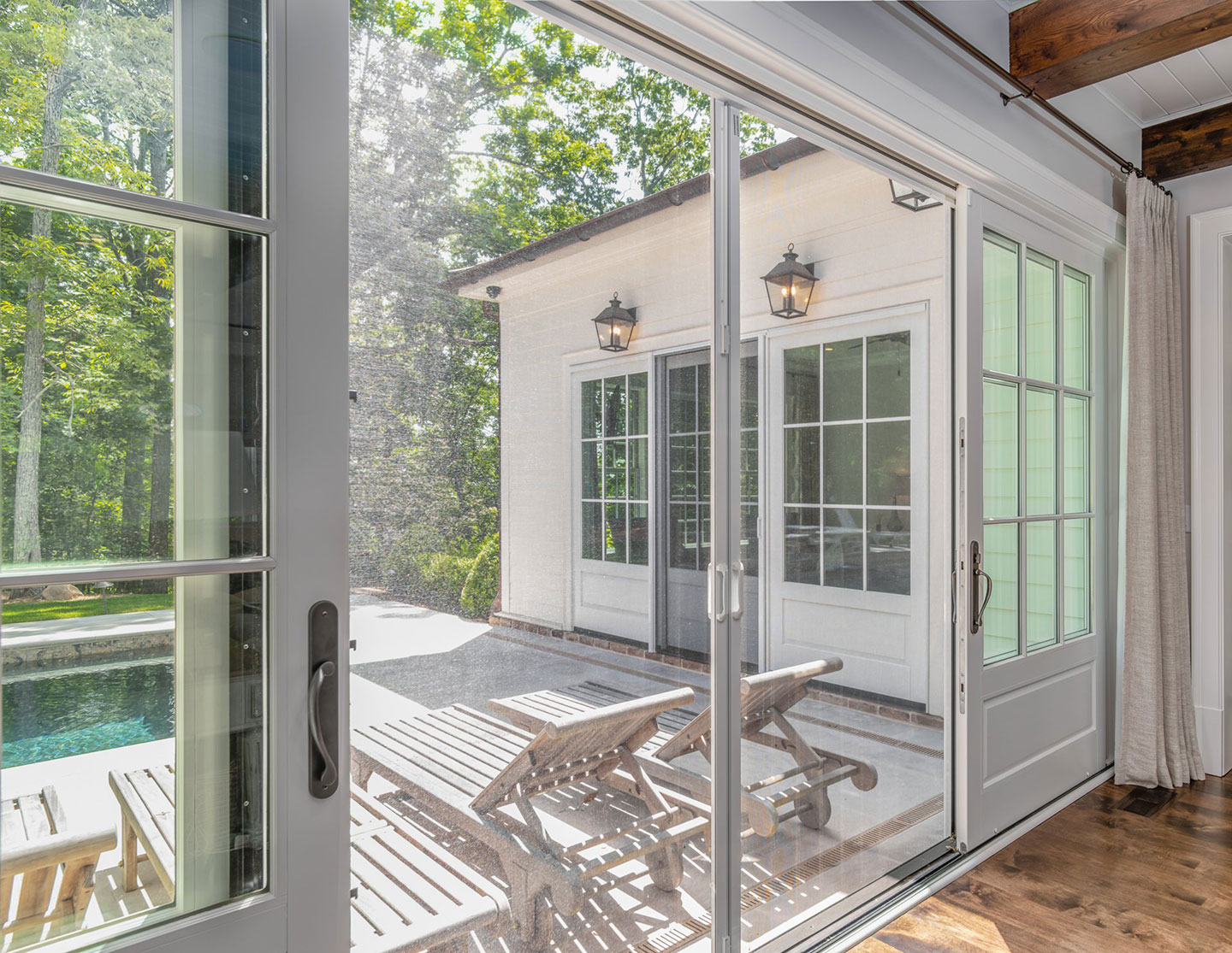 Retractable screen system across a set of white French doors