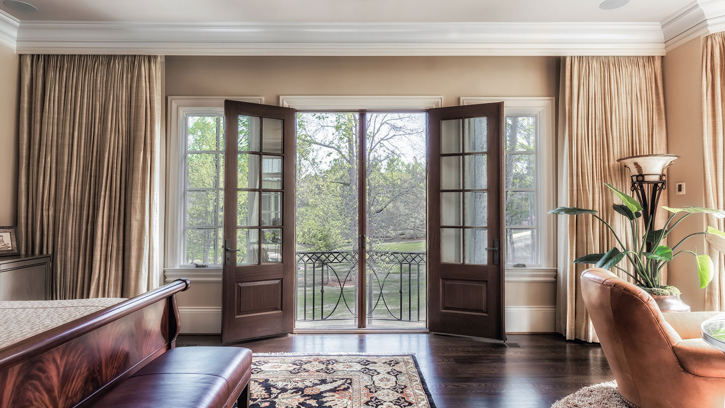 Retractable screen installed at a wide interior-to-patio doorway